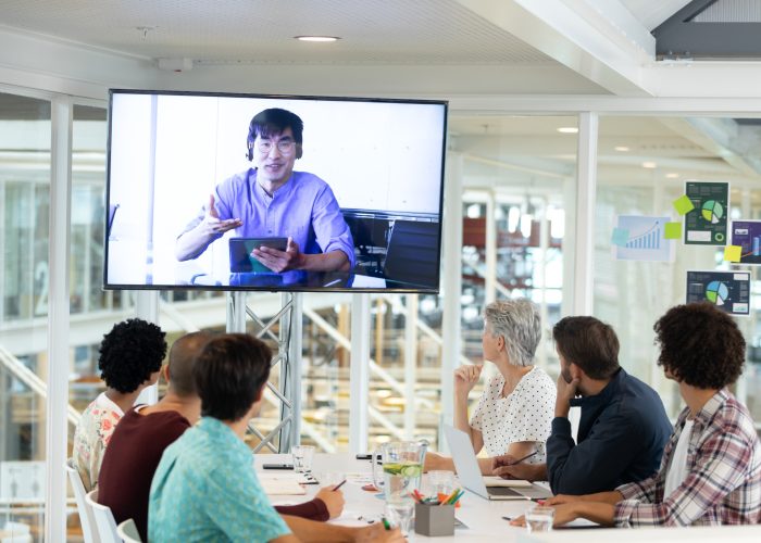 Senior managers at a hybrid event