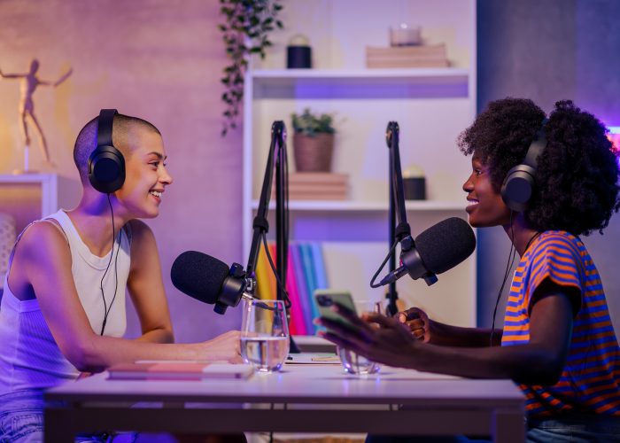 Two women recording a podcast episode
